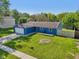 Well-maintained single-story home with a spacious front yard, attached garage, and an American flag at 7645 Madden Dr, Fishers, IN 46038
