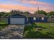 Charming single-story home with a well-manicured lawn and attached garage at 7645 Madden Dr, Fishers, IN 46038