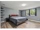 Main bedroom showcasing hardwood floors, floating shelves, and an ensuite bathroom at 7645 Madden Dr, Fishers, IN 46038