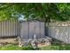 A backyard shed provides additional storage space surrounded by mature trees and landscaping at 7645 Madden Dr, Fishers, IN 46038