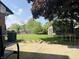 The backyard features a small shed, a trampoline, and an area to relax in the sun, providing plenty of space at 7764 Hollybrook Ln, Southport, IN 46227