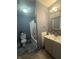 Well-maintained bathroom with a shower-tub combo, modern fixtures, a vanity with a sink, and a toilet, offering functionality at 7764 Hollybrook Ln, Southport, IN 46227