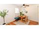 View of dining area and adjacent bench seating with hardwood floors and natural light at 7849 E 49Th St, Indianapolis, IN 46226