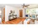 Living room featuring hardwood floors, comfortable seating, decor, and stylish lighting at 7849 E 49Th St, Indianapolis, IN 46226