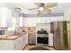 Well-equipped kitchen featuring stainless steel appliances, butcher block countertops, and white cabinetry at 7849 E 49Th St, Indianapolis, IN 46226