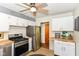 Modern kitchen with stainless steel appliances, butcher block countertops, and ample cabinet space at 7849 E 49Th St, Indianapolis, IN 46226