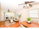 Open-concept view of the living room and dining area with ample natural light and hardwood flooring at 7849 E 49Th St, Indianapolis, IN 46226