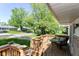 Outdoor porch view with patio furniture set and view of the grassy neighborhood at 7849 E 49Th St, Indianapolis, IN 46226