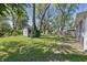 Large backyard with lush lawn and mature trees at 807 Vasbinder Dr, Chesterfield, IN 46017