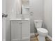 This bathroom features neutral paint, a toilet and a white vanity at 807 Vasbinder Dr, Chesterfield, IN 46017