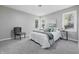 Cozy bedroom with carpeted floors, neutral walls, and a comfortable bed with stylish decor, creating a relaxing retreat at 807 Vasbinder Dr, Chesterfield, IN 46017