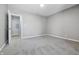 Bedroom featuring neutral walls, carpeted floors and an open doorway at 807 Vasbinder Dr, Chesterfield, IN 46017