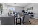Bright living room with modern decor, hardwood floors, large windows, and neutral-colored furniture, creating a cozy atmosphere at 807 Vasbinder Dr, Chesterfield, IN 46017