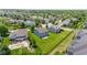 Aerial view of houses with green lawns and a pond in a residential neighborhood at 8178 Eskerban Dr, Avon, IN 46123