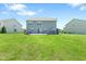 Large backyard featuring a lush green lawn and spacious patio perfect for outdoor entertaining at 8178 Eskerban Dr, Avon, IN 46123