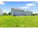 Large backyard featuring a lush green lawn and spacious patio perfect for outdoor entertaining at 8178 Eskerban Dr, Avon, IN 46123