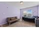 Bedroom with a bed, sofa, and window providing natural light at 8178 Eskerban Dr, Avon, IN 46123