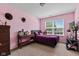 Cozy bedroom showcasing a bed, window, carpet flooring, and desk at 8178 Eskerban Dr, Avon, IN 46123