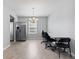 Bright dining room with chandelier and stainless steel refrigerator at 8178 Eskerban Dr, Avon, IN 46123