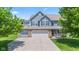 Charming two-story home with a three-car garage and a well-manicured front yard at 8178 Eskerban Dr, Avon, IN 46123