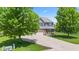 Charming two-story home with a well-manicured lawn, mature trees, and a cozy front porch at 8178 Eskerban Dr, Avon, IN 46123