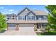 Charming two-story home with a three car garage, blue shutters and beautiful curb appeal at 8178 Eskerban Dr, Avon, IN 46123