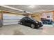 Spacious two-car garage with storage and black vehicles parked inside at 8178 Eskerban Dr, Avon, IN 46123