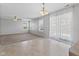 A spacious living area blends tile and carpeted flooring, with plenty of natural light from the windows and sliding glass door at 8178 Eskerban Dr, Avon, IN 46123