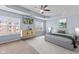 Bright main bedroom with trey ceiling, carpet, and many windows showing outdoor landscape at 8178 Eskerban Dr, Avon, IN 46123