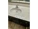 Close up of bathroom sink with single faucet and white faux-marble countertop at 837 Sommersweet Run, Greenwood, IN 46143