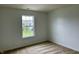 A bedroom with carpet, and a large window at 837 Sommersweet Run, Greenwood, IN 46143
