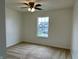 A bedroom featuring a ceiling fan and window at 837 Sommersweet Run, Greenwood, IN 46143