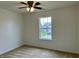 A carpeted bedroom features neutral walls and a window at 837 Sommersweet Run, Greenwood, IN 46143