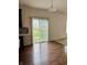 Bright dining area with hardwood floors and sliding glass doors leading to outdoor space at 837 Sommersweet Run, Greenwood, IN 46143