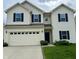 Charming two-story home featuring black shutters, a two-car garage, and a well-maintained lawn at 837 Sommersweet Run, Greenwood, IN 46143