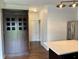 Open kitchen space, stainless steel refrigerator, and a large walk-in pantry, adjacent to the modern kitchen at 837 Sommersweet Run, Greenwood, IN 46143