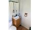 Bathroom with a single sink vanity, medicine cabinet mirror, and toilet at , Martinsville, IN 46151