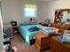 Bright bedroom with a cozy bed, wooden dresser and ample natural light at , Martinsville, IN 46151