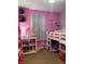 Charming pink bedroom featuring a whimsical bunk bed and delightful decor at , Martinsville, IN 46151