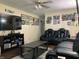 Comfortable living room with plush leather seating, a ceiling fan, and entertainment center at , Martinsville, IN 46151