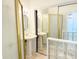 Bathroom with dual sinks reflected in mirrored closet doors at 8835 Briarclift Rd, Indianapolis, IN 46256