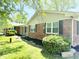 Brick home showcasing a covered porch with support columns, enhancing its curb appeal at 8835 Briarclift Rd, Indianapolis, IN 46256