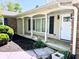 Covered front porch with white columns and a white front door on a sunny day at 8835 Briarclift Rd, Indianapolis, IN 46256