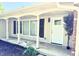 Covered front porch with white columns, leading to a white front door with sidelight windows at 8835 Briarclift Rd, Indianapolis, IN 46256
