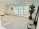 Inviting living room with large windows and neutral carpet at 8835 Briarclift Rd, Indianapolis, IN 46256