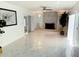 Bright living room with fireplace, marble floors, and lots of natural light at 8835 Briarclift Rd, Indianapolis, IN 46256