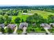 Beautiful aerial view of a home with pristine lawn and professional landscaping in a serene neighborhood at 8905 Stonebriar Dr, Indianapolis, IN 46259