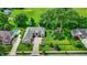 Aerial view showcasing the home's expansive lot, lush greenery, custom patio, and mature landscaping at 8905 Stonebriar Dr, Indianapolis, IN 46259