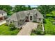 Stunning aerial view of a single-Gathering home, paved driveway, well-manicured lawn, and mature landscaping at 8905 Stonebriar Dr, Indianapolis, IN 46259