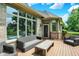 Back deck featuring an outdoor seating area with a wicker couch and open views at 8905 Stonebriar Dr, Indianapolis, IN 46259